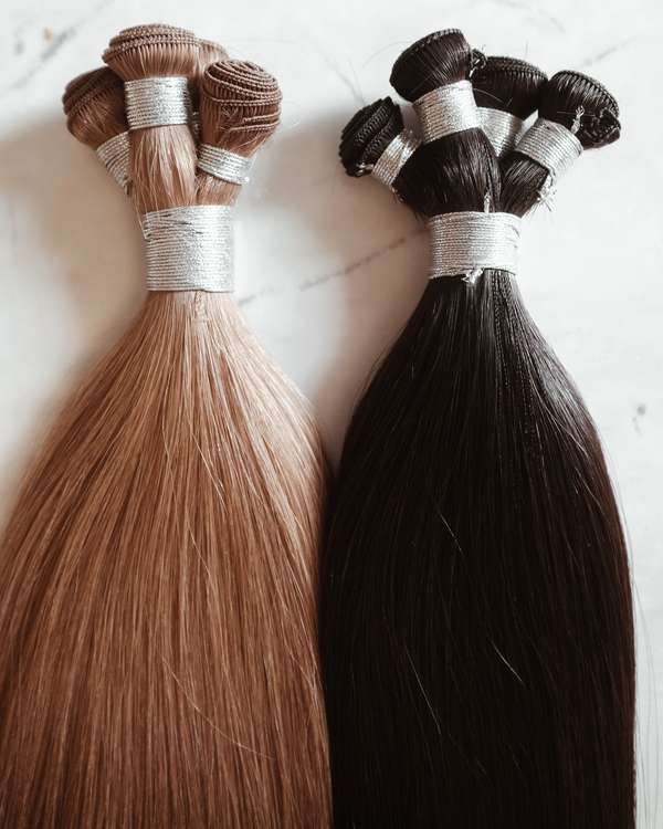 Bundles of Hairlaya hand-tied extensions.